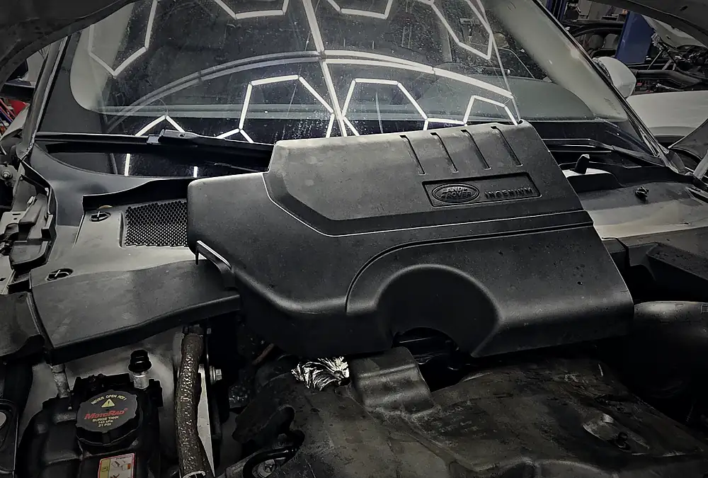 Land Rover Ingenium engine under the open hood in the Prestige shop