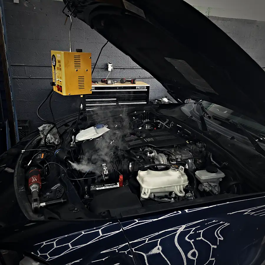 Smoke-machine leak test on an engine to find a vacuum or EVAP leak