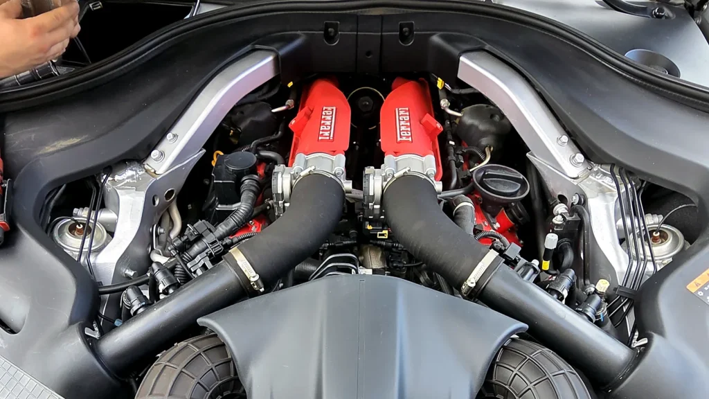 Close-up of a Ferrari twin-turbo V8 engine during service at Prestige in Oakland Park